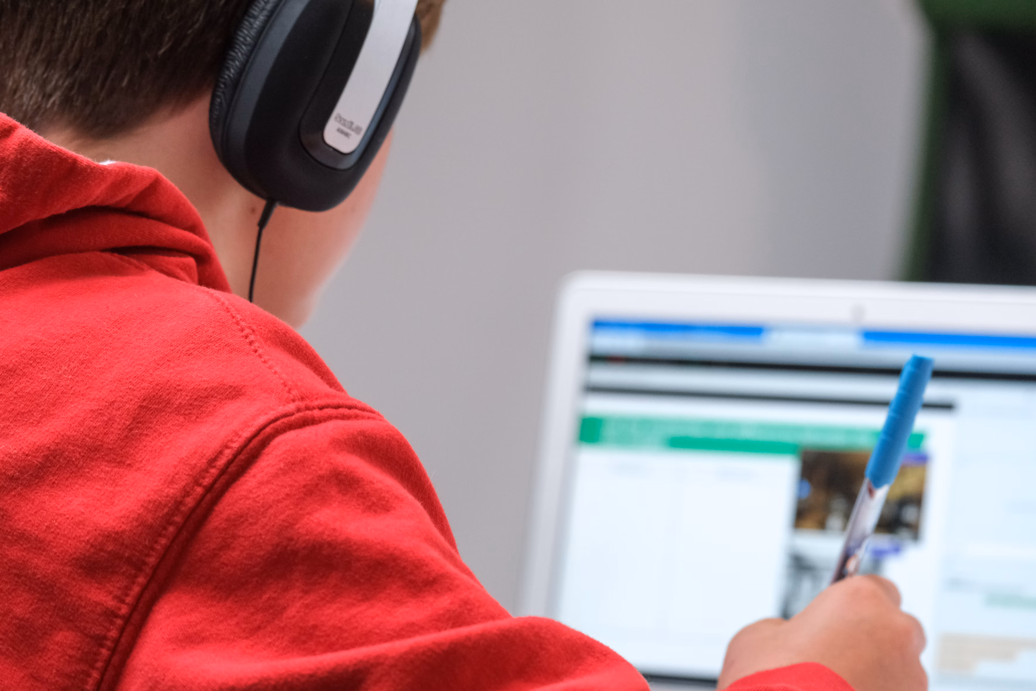 Diverse group of students engaged in online learning using educational technology